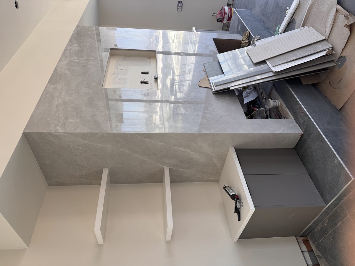Marble countertop with waterfall edge and sink cutout