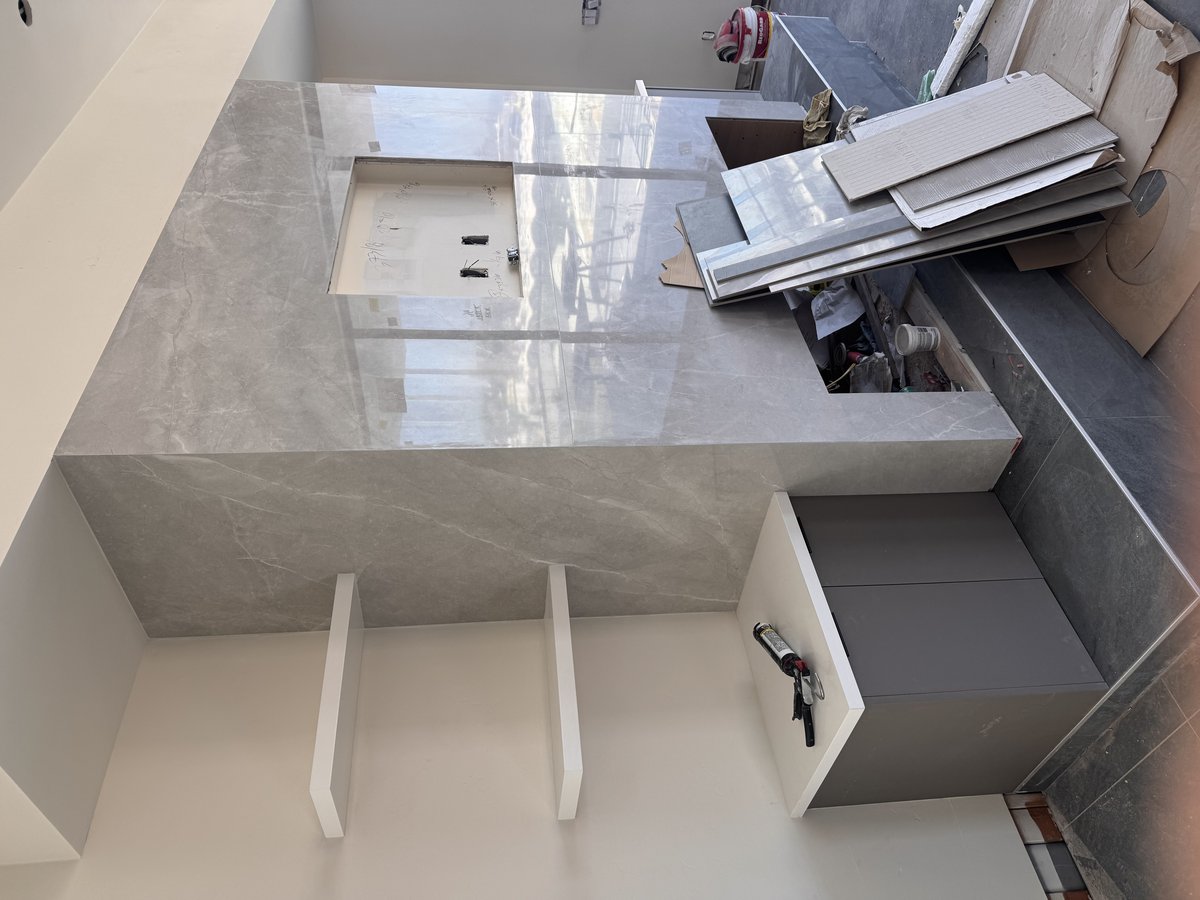 L-shaped counter with modern white cabinets